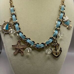 Ocean themed necklace with animal and other sea related charms. Two with enamel